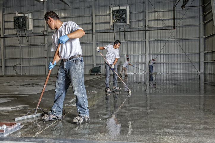 Men polishing floor