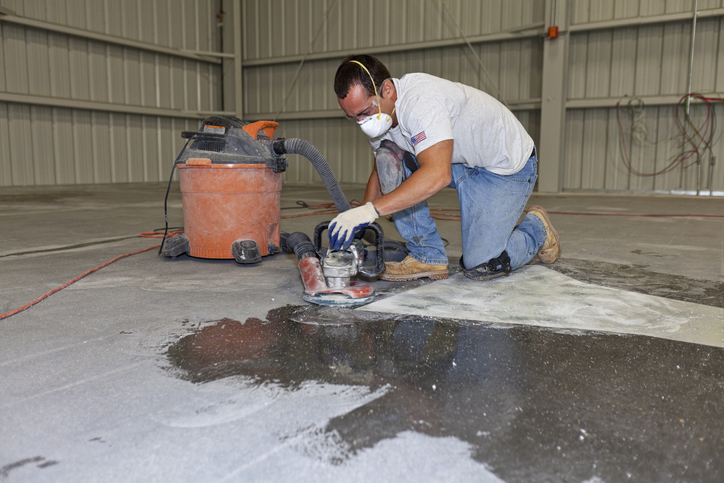 Young man sanding epoxy